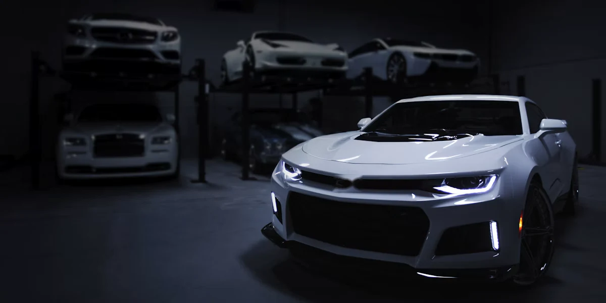 Vehicles displayed in a showroom for inventory demand planning